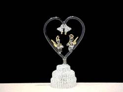 Angels wedding cake top with two solid glass Angels with wings inside a heart. Pain from the heart our knitted glass wedding bells