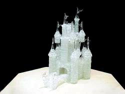 this is a very large knitted glass Castle wedding cake top that comes in several pieces including a drawbridge