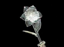 solid hand blown glass flower with two solid glass leaves and a straight stem
